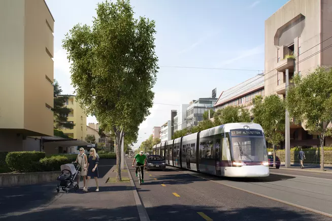 Moderne Strassenbahn in einer urbanen Umgebung mit Grünflächen und Radfahrern.