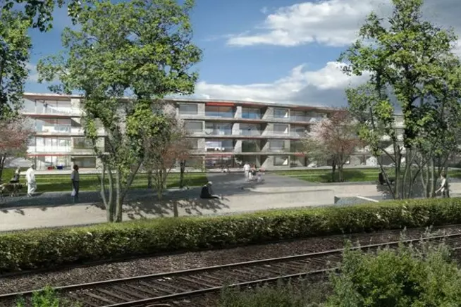 Moderne Wohnanlage mit blühenden Bäumen und Wegen, umgeben von einem ruhigen Umfeld.